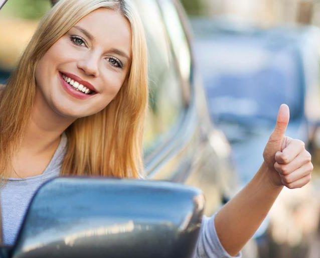 Woman-happy-with-car-1078x516